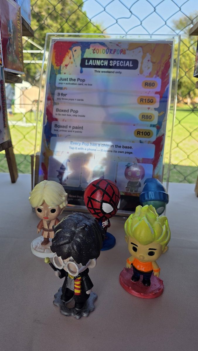 Painted Pops in front of the launch special board