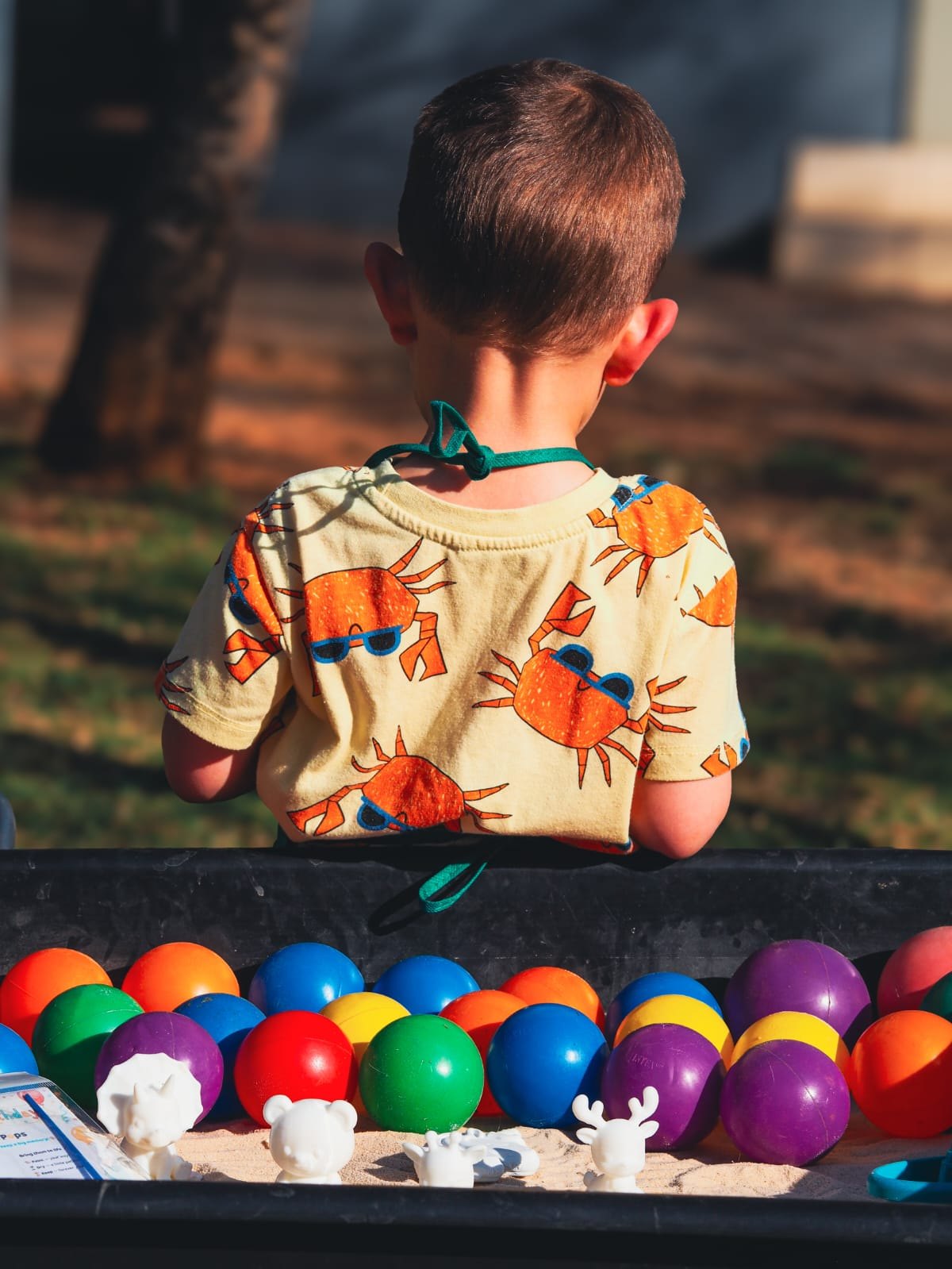 A child with painted Pops on a table